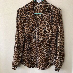 Express the portfolio shirt in animal print. Size small/P.